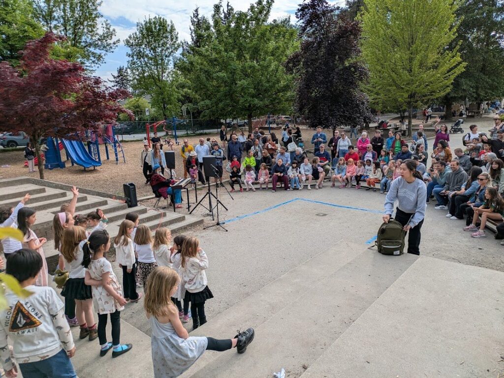 Children getting ready to sing in an outdoor venue